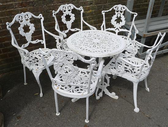 5 garden chairs and a table